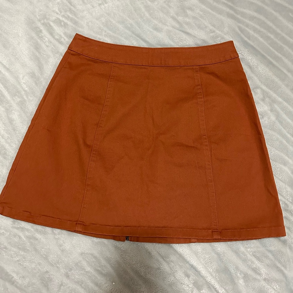 Brown skirt, darker in person